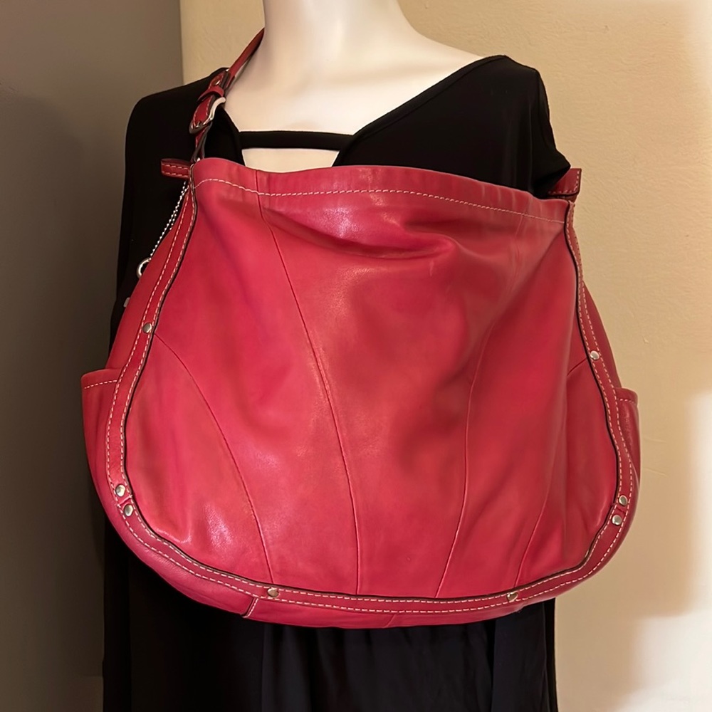 Fossil cranberry pink color, great leather bag